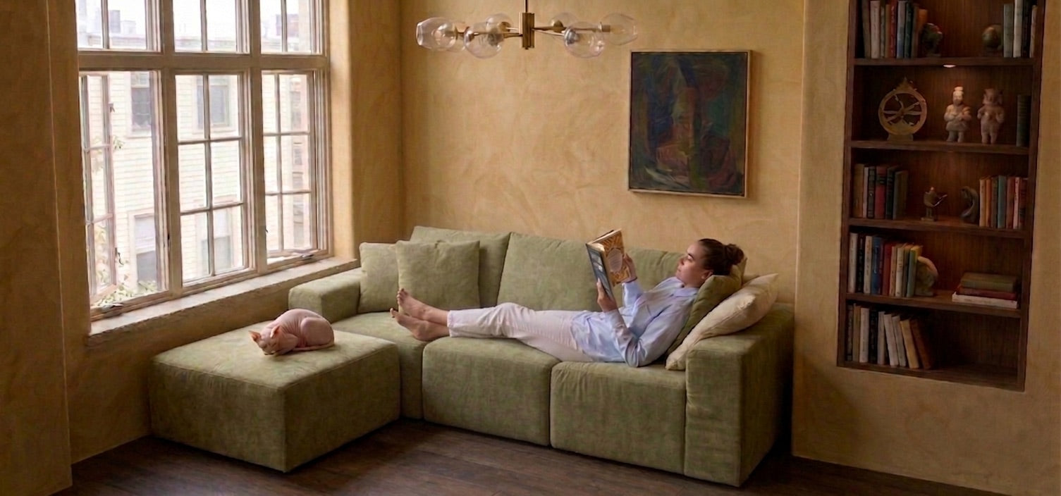Person relaxing on the assembled Modu cube sofa